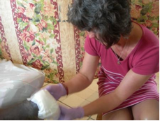 Ros Thomas dressing a diabetic leg ulcer during a visit to The Gambia